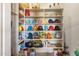 Walk-in pantry boasts ample shelving space, perfect for organized storage at 18036 W San Miguel Ave, Litchfield Park, AZ 85340