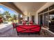 Inviting covered patio features ample seating with a pool view, perfect for entertaining at 18036 W San Miguel Ave, Litchfield Park, AZ 85340