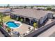 Outdoor oasis features a kidney shaped pool, covered patio, outdoor kitchen, and lush landscaping at 18036 W San Miguel Ave, Litchfield Park, AZ 85340