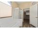 Bright bathroom features a soaking tub, glass shower, and walk-in closet at 18242 W Stinson Dr, Surprise, AZ 85374