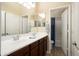 This bright bathroom features a double sink vanity and a separate toilet room at 18242 W Stinson Dr, Surprise, AZ 85374