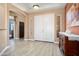 Inviting foyer with light wood floors and a view of an artfully decorated console table at 18242 W Stinson Dr, Surprise, AZ 85374