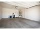 Spacious two car garage with ample room for storage and door to the home interior at 18242 W Stinson Dr, Surprise, AZ 85374