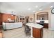 Open-concept kitchen with a central island connecting to the living area, perfect for entertaining at 18242 W Stinson Dr, Surprise, AZ 85374