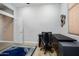 The office features a large desk with a black chair and a blue patterned rug at 18242 W Stinson Dr, Surprise, AZ 85374
