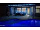 Inviting backyard pool and covered patio area, perfect for evening relaxation and entertaining at 18242 W Stinson Dr, Surprise, AZ 85374