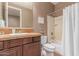 Bathroom with a single sink, warm tile, and a combined shower-tub at 19427 W Colter St, Litchfield Park, AZ 85340