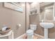 Cozy half bathroom with decorative coastal themed decor at 19427 W Colter St, Litchfield Park, AZ 85340