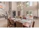 Elegant dining room with a large table, modern decor, and ample natural light at 19427 W Colter St, Litchfield Park, AZ 85340