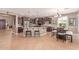 Spacious kitchen featuring a large island with seating, dark wood cabinets, and stainless steel appliances at 19427 W Colter St, Litchfield Park, AZ 85340