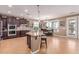 Bright kitchen with a central island, stainless steel appliances, and adjacent dining area with natural light at 19427 W Colter St, Litchfield Park, AZ 85340
