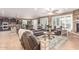 Open-concept living room with tile flooring, a fireplace, and a view into the kitchen at 19427 W Colter St, Litchfield Park, AZ 85340