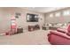 Spacious living room has cozy seating, a large TV, and unique decor at 19427 W Colter St, Litchfield Park, AZ 85340