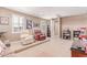 Inviting living room featuring a raised platform and comfortable seating arrangement at 19427 W Colter St, Litchfield Park, AZ 85340