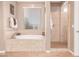 Bathroom showcasing a soaking tub and separate walk-in shower at 19427 W Colter St, Litchfield Park, AZ 85340