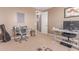 Bright home office equipped with a desk, comfortable seating, and neutral decor at 19427 W Colter St, Litchfield Park, AZ 85340