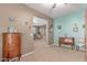 Sitting area with two antique dressers, decorative art, and a view to the ensuite at 19427 W Colter St, Litchfield Park, AZ 85340