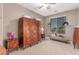 Sitting room featuring a daybed, side tables and vintage wardrobe at 19427 W Colter St, Litchfield Park, AZ 85340