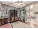 Cozy wine room with custom storage, unique decorations, and hardwood flooring at 19427 W Colter St, Litchfield Park, AZ 85340