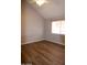 Bright bedroom with ceiling fan and wood look floors at 2144 E Center Ln # 3, Tempe, AZ 85281