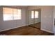 Bedroom with hardwood floors and large window at 2144 E Center Ln # 3, Tempe, AZ 85281