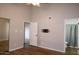 Bedroom with hardwood floors, ceiling fan, and access to bathroom at 2144 E Center Ln # 3, Tempe, AZ 85281