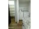 Convenient laundry area with storage shelves and updated appliances at 2144 E Center Ln # 3, Tempe, AZ 85281