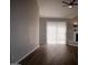 Bright living area with wood floors and natural light from sliding glass door at 2144 E Center Ln # 3, Tempe, AZ 85281