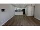Open-concept living area showcases wood flooring, and seamlessly connects to the updated kitchen at 2144 E Center Ln # 3, Tempe, AZ 85281