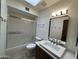Bathroom featuring a shower-tub combo, single vanity, and a skylight at 2169 E Bishop Dr, Tempe, AZ 85282