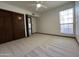Bright bedroom featuring carpet, closet, and window at 2169 E Bishop Dr, Tempe, AZ 85282