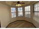 Bright breakfast nook featuring large windows and a ceiling fan at 2169 E Bishop Dr, Tempe, AZ 85282