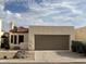 View of home with two-car garage and tile roof at 2169 E Bishop Dr, Tempe, AZ 85282