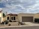 Charming single-story home featuring a tile roof, desert landscaping, and a two-car garage at 2169 E Bishop Dr, Tempe, AZ 85282