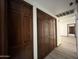Hallway featuring beautiful paneled closet doors, modern flooring and neutral wall paint at 2169 E Bishop Dr, Tempe, AZ 85282