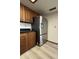View of kitchen cabinets and stainless steel refrigerator at 2169 E Bishop Dr, Tempe, AZ 85282