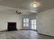 Bright living room featuring a fireplace, tile flooring, neutral walls and modern light fixtures at 2169 E Bishop Dr, Tempe, AZ 85282
