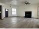 Bright living room featuring a fireplace, tile flooring, neutral walls and modern light fixtures at 2169 E Bishop Dr, Tempe, AZ 85282