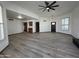 Open concept living room with custom cabinetry, tile flooring, neutral walls and modern lighting at 2169 E Bishop Dr, Tempe, AZ 85282