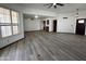 Open concept living room with custom cabinetry, tile flooring, neutral walls and modern lighting at 2169 E Bishop Dr, Tempe, AZ 85282