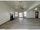 Spacious living room with ample natural light, tile flooring, fireplace and modern ceiling fan fixture at 2169 E Bishop Dr, Tempe, AZ 85282