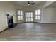 Bright living room with a fireplace, wood-look floors, and natural light from several windows at 2169 E Bishop Dr, Tempe, AZ 85282