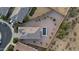 Aerial view of the backyard, home and neighborhood shows landscaping and layout at 21797 N 259Th Ave, Buckeye, AZ 85396