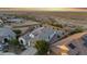 This aerial shows the rear exterior with tile roofs, and fenced yards with desert landscaping at 21797 N 259Th Ave, Buckeye, AZ 85396