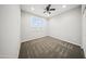 Bright bedroom with carpet, ceiling fan and a large window offering plenty of natural light at 21797 N 259Th Ave, Buckeye, AZ 85396