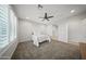 Bright bedroom featuring neutral paint, plush carpet, and plantation shutters for a warm and inviting atmosphere at 21797 N 259Th Ave, Buckeye, AZ 85396