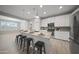 Kitchen with a breakfast bar and pendant lights, stainless appliances, and granite counters at 21797 N 259Th Ave, Buckeye, AZ 85396