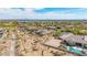 High angle shot showcasing luxurious desert homes with pools, xeriscaping, privacy walls, and mountain views at 2255 N Hillridge --, Mesa, AZ 85207