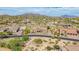 Aerial view of this home features desert landscaping, a stone exterior and a beautiful mountain view at 2255 N Hillridge --, Mesa, AZ 85207