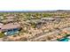 Aerial view of a desert home with a private pool, surrounded by xeriscaping and a retaining wall for privacy at 2255 N Hillridge --, Mesa, AZ 85207